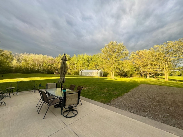 11946 180th St, Milaca Twp, MN 56353 - view of patio / terrace featuring outdoor dining space and an outdoor structure