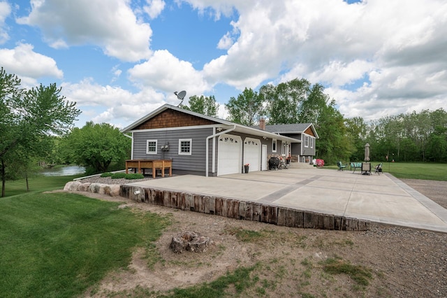 11946 180th St, Milaca Twp, MN 56353 - view of front of property featuring an attached garage, a front lawn, driveway, and a chimney
