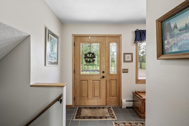 11946 180th St, Milaca Twp, MN 56353 - entryway featuring a baseboard radiator, tile patterned flooring, and baseboards