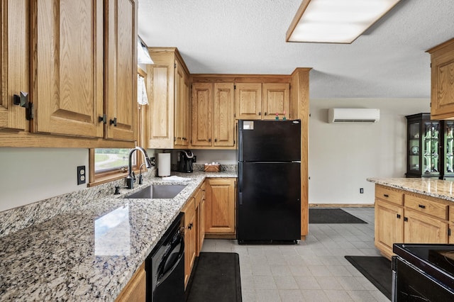 11946 180th St, Milaca Twp, MN 56353 - kitchen with black appliances, a wall mounted air conditioner, a sink, light stone countertops, and a textured ceiling
