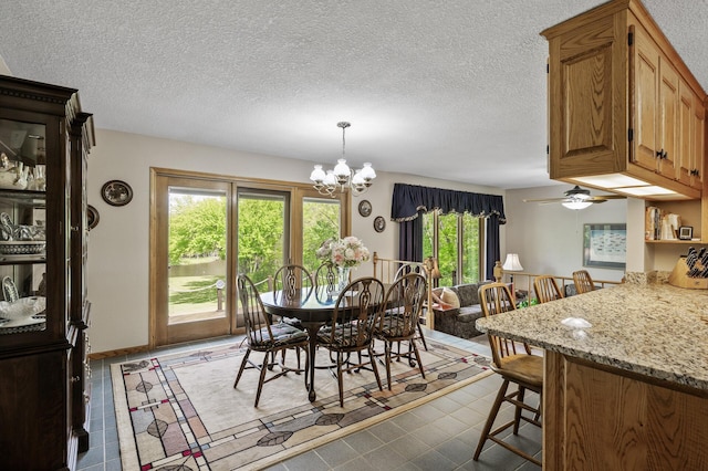 11946 180th St, Milaca Twp, MN 56353 - dining space featuring a chandelier and a textured ceiling