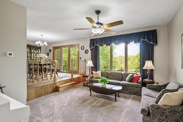 11946 180th St, Milaca Twp, MN 56353 - living area featuring carpet flooring, a ceiling fan, and a chandelier