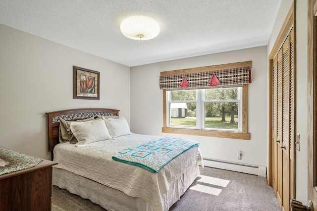 11946 180th St, Milaca Twp, MN 56353 - carpeted bedroom with baseboard heating, a closet, and a textured ceiling