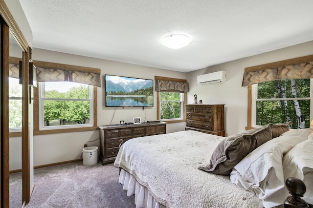 11946 180th St, Milaca Twp, MN 56353 - carpeted bedroom featuring a wall mounted air conditioner, multiple windows, and baseboards