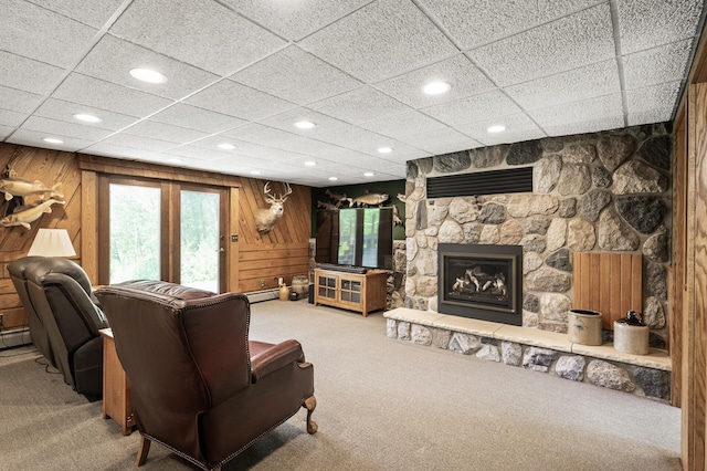 11946 180th St, Milaca Twp, MN 56353 - living area with carpet, plenty of natural light, recessed lighting, a fireplace, and wooden walls