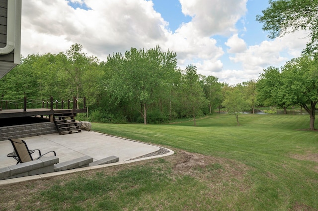 11946 180th St, Milaca Twp, MN 56353 - view of grassy yard featuring a patio area and a deck