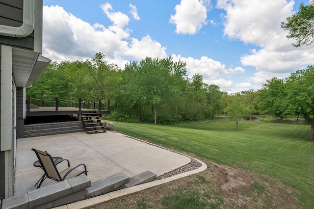 11946 180th St, Milaca Twp, MN 56353 - view of grassy yard featuring a patio and a wooden deck
