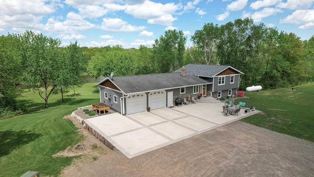11946 180th St, Milaca Twp, MN 56353 - tri-level home with an attached garage, driveway, and a front yard