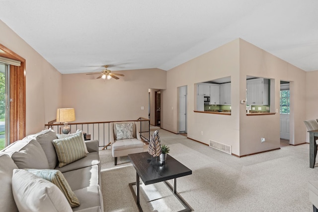 3225 Hillsboro Ave N, New Hope, MN 55427 - living room featuring vaulted ceiling, a ceiling fan, and light carpet