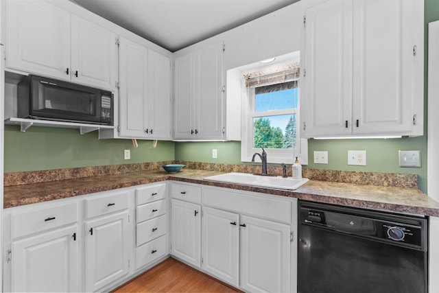 3225 Hillsboro Ave N, New Hope, MN 55427 - kitchen featuring black appliances, white cabinetry, light wood-style flooring, and dark countertops