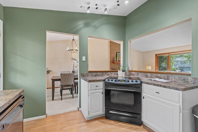 3225 Hillsboro Ave N, New Hope, MN 55427 - kitchen with black electric range, white cabinetry, and dark countertops