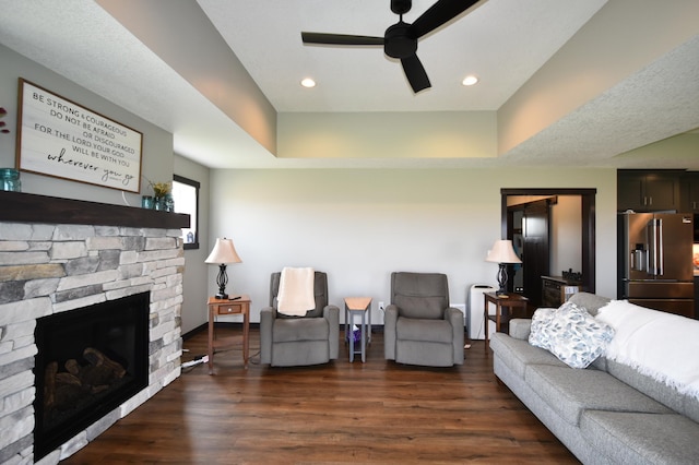 1800 20th Avenue Cir NE, Kasson, MN 55944 - living area with a fireplace, ceiling fan, dark wood-style floors, a tray ceiling, and recessed lighting
