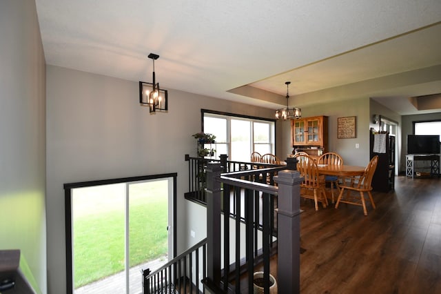 1800 20th Avenue Cir NE, Kasson, MN 55944 - dining area with a chandelier, dark wood finished floors, and a raised ceiling