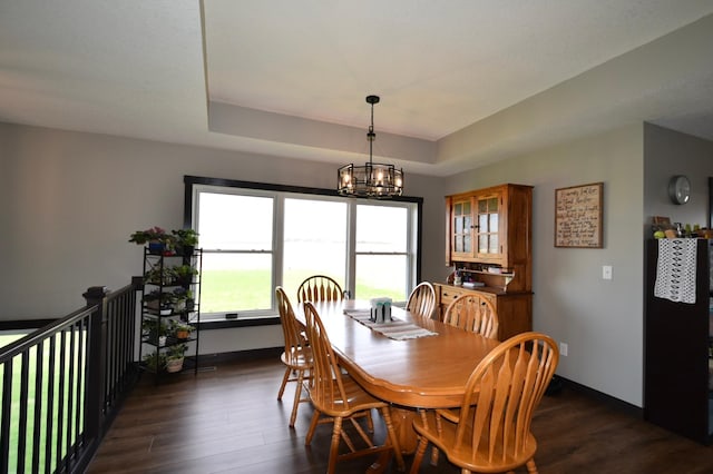 1800 20th Avenue Cir NE, Kasson, MN 55944 - dining area with a chandelier, dark wood-style floors, a raised ceiling, and baseboards