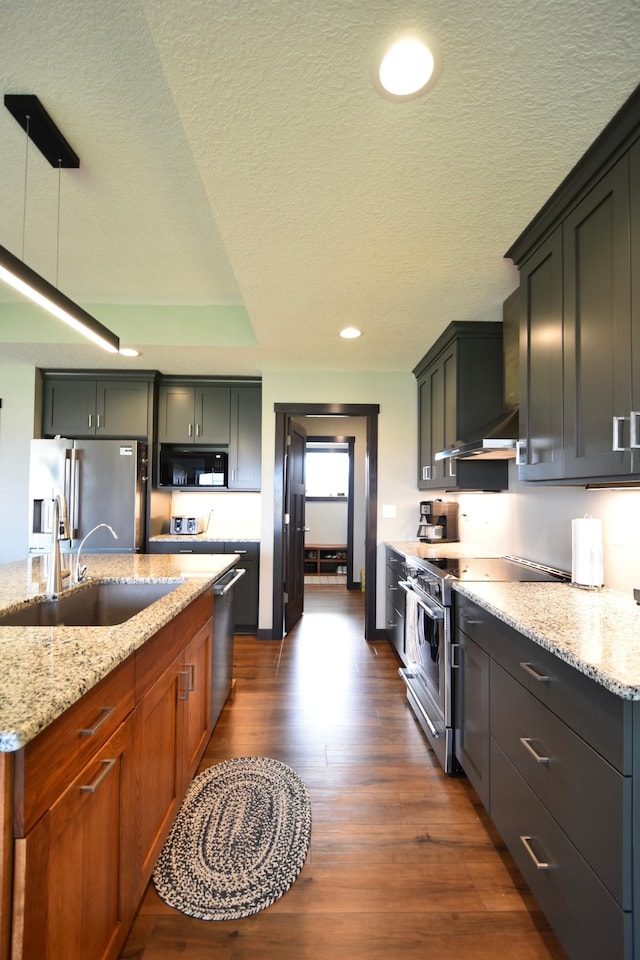 1800 20th Avenue Cir NE, Kasson, MN 55944 - kitchen with appliances with stainless steel finishes, a sink, dark wood-type flooring, a textured ceiling, and light stone counters