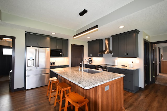 1800 20th Avenue Cir NE, Kasson, MN 55944 - kitchen with appliances with stainless steel finishes, a sink, wall chimney range hood, dark wood-type flooring, and light stone counters