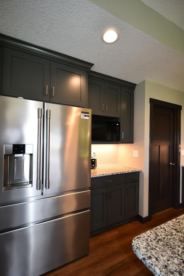 1800 20th Avenue Cir NE, Kasson, MN 55944 - kitchen with high end refrigerator, black microwave, dark wood-type flooring, light stone countertops, and recessed lighting