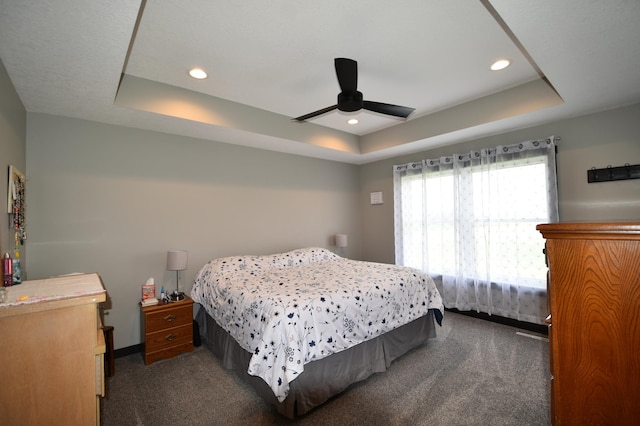 1800 20th Avenue Cir NE, Kasson, MN 55944 - bedroom with a tray ceiling, dark carpet, a ceiling fan, and recessed lighting