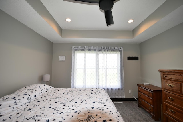 1800 20th Avenue Cir NE, Kasson, MN 55944 - bedroom with dark carpet, a raised ceiling, baseboards, recessed lighting, and ceiling fan