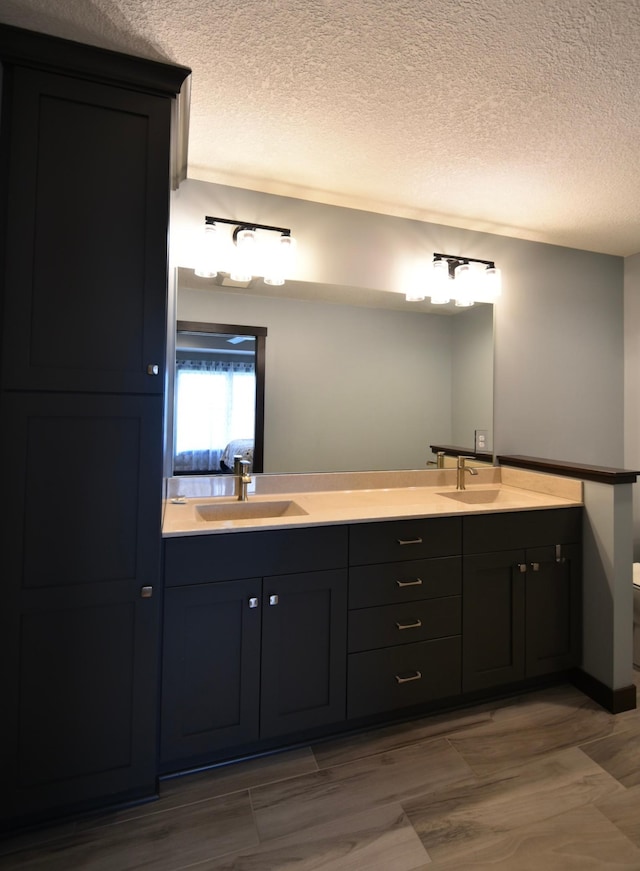 1800 20th Avenue Cir NE, Kasson, MN 55944 - full bathroom featuring double vanity, a textured ceiling, wood finished floors, and toilet
