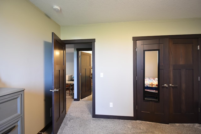 1800 20th Avenue Cir NE, Kasson, MN 55944 - bedroom featuring light colored carpet, a closet, and a textured ceiling
