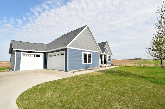 1800 20th Avenue Cir NE, Kasson, MN 55944 - view of side of home featuring driveway, a garage, a lawn, and roof with shingles