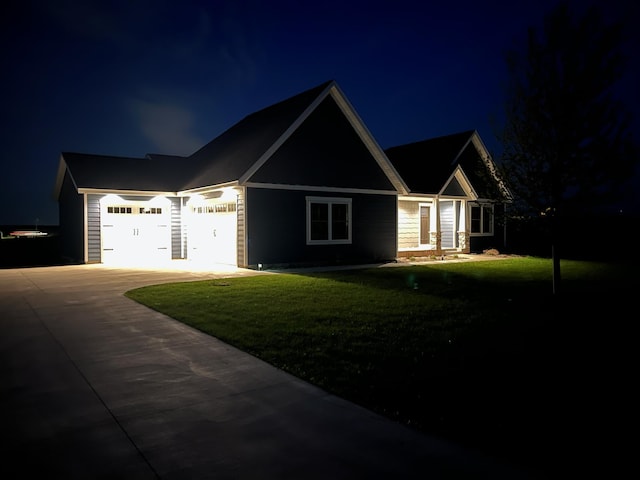 1800 20th Avenue Cir NE, Kasson, MN 55944 - view of front of home with driveway, an attached garage, and a lawn