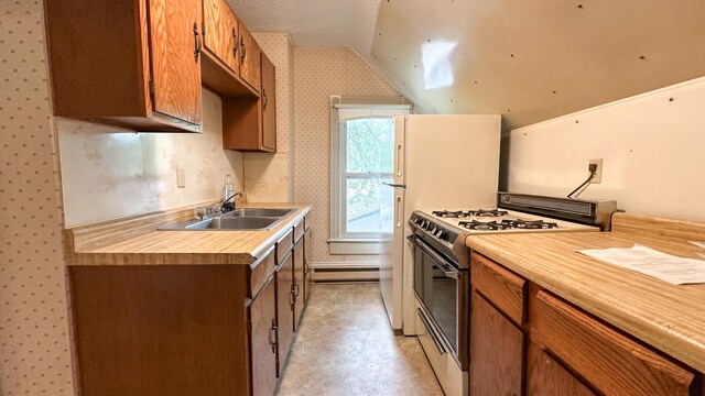 226 3rd Ave NE, Saint Cloud, MN 56304 - kitchen featuring range with gas cooktop, vaulted ceiling, wallpapered walls, a sink, and light countertops