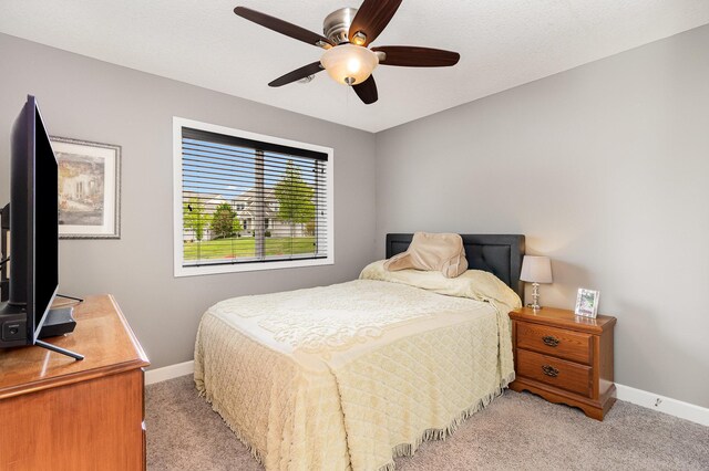 4740 Ashton Curv, Woodbury, MN 55129 - bedroom with light colored carpet, baseboards, and ceiling fan