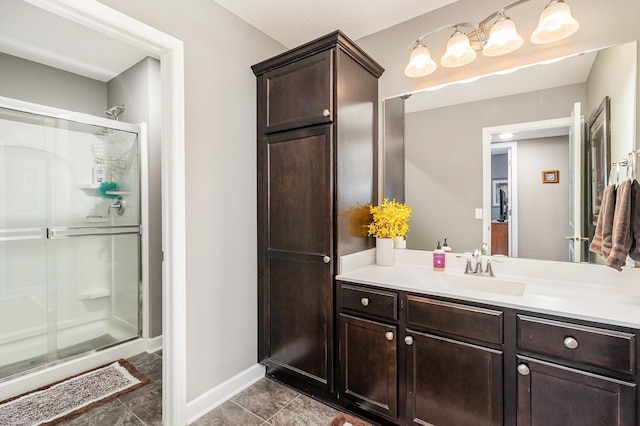 4740 Ashton Curv, Woodbury, MN 55129 - bathroom with a shower stall, vanity, and baseboards