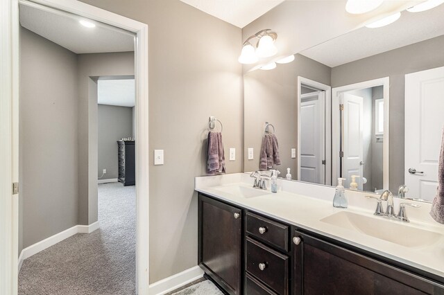 4740 Ashton Curv, Woodbury, MN 55129 - bathroom featuring double vanity and baseboards