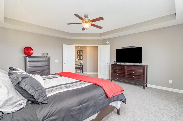 4740 Ashton Curv, Woodbury, MN 55129 - carpeted bedroom with baseboards, a raised ceiling, and a ceiling fan