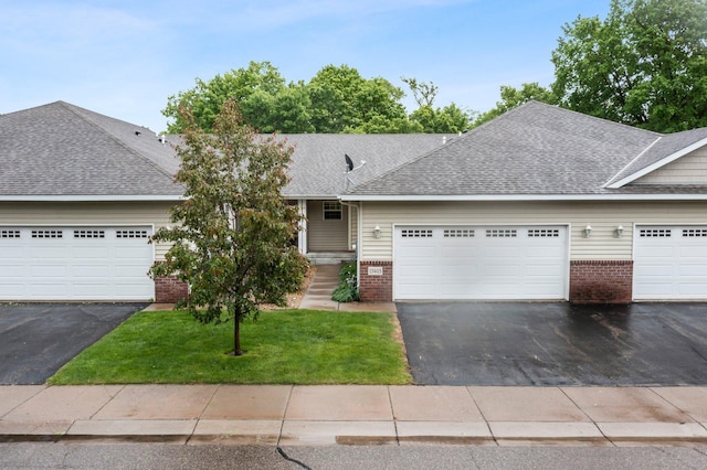 13403 96th Pl N, Maple Grove, MN 55369 - view of front of home with brick siding, asphalt driveway, an attached garage, and roof with shingles