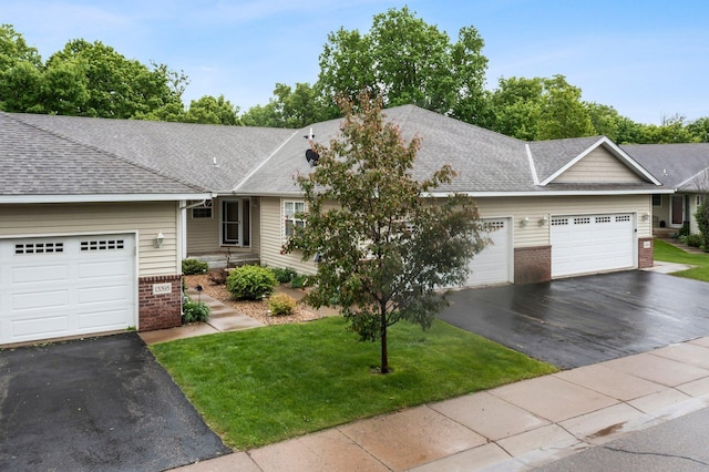 13403 96th Pl N, Maple Grove, MN 55369 - ranch-style home with brick siding, driveway, a garage, and a front yard