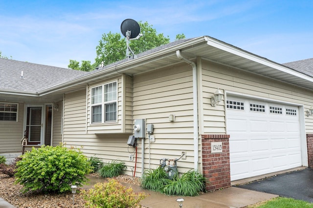 13403 96th Pl N, Maple Grove, MN 55369 - view of home's exterior with roof with shingles