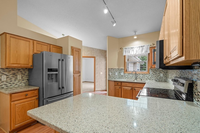 13403 96th Pl N, Maple Grove, MN 55369 - kitchen with appliances with stainless steel finishes, a sink, a peninsula, backsplash, and lofted ceiling