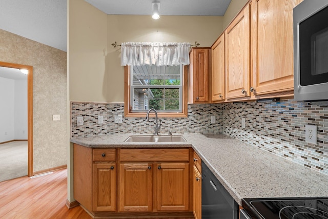 13403 96th Pl N, Maple Grove, MN 55369 - kitchen with stainless steel microwave, dishwashing machine, a sink, light wood-style floors, and tasteful backsplash