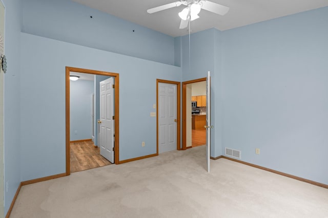 13403 96th Pl N, Maple Grove, MN 55369 - unfurnished bedroom featuring carpet floors, baseboards, a ceiling fan, and high vaulted ceiling
