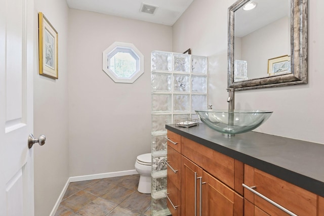 3806 Sunset Dr, Spring Park, MN 55384 - bathroom with vanity, toilet, and baseboards