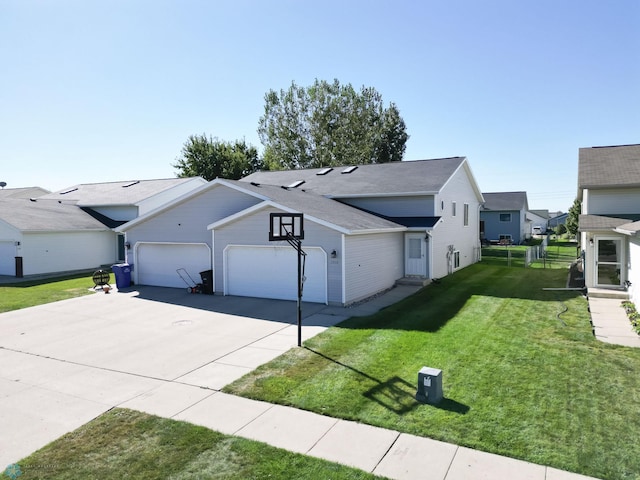 view of front of property with a garage, concrete driveway, and a front yard