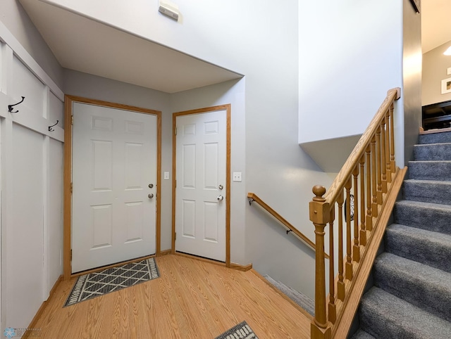 entryway featuring light wood-style flooring and baseboards