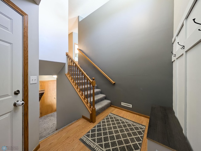 staircase featuring wood finished floors