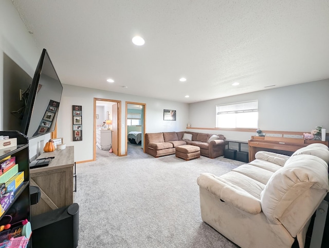 carpeted living area featuring recessed lighting