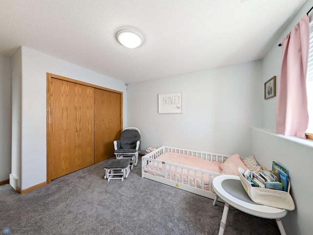 bedroom with carpet and a closet