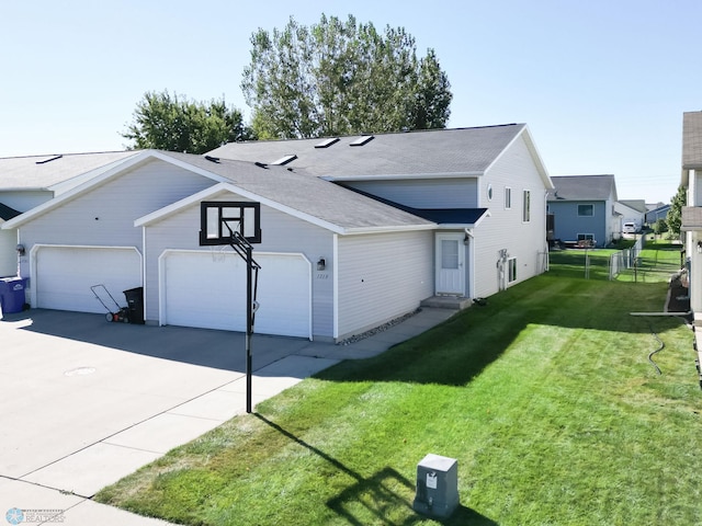 view of front facade with driveway, a garage, entry steps, and a shingled roof