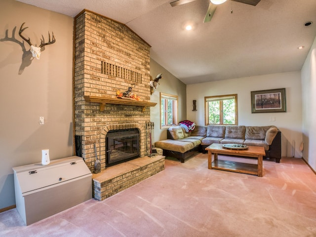 300 27th St NE, Bemidji, MN 56601 - living room with carpet, lofted ceiling, a fireplace, and ceiling fan