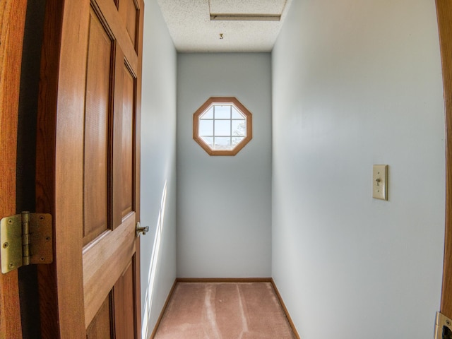 300 27th St NE, Bemidji, MN 56601 - spare room with attic access, baseboards, and a textured ceiling