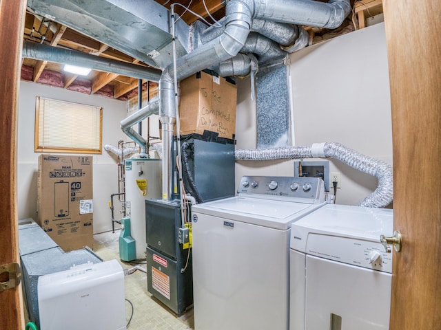 300 27th St NE, Bemidji, MN 56601 - laundry room featuring washing machine and dryer and gas water heater