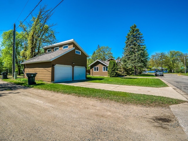 300 27th St NE, Bemidji, MN 56601 - view of home's exterior with a garage and a yard
