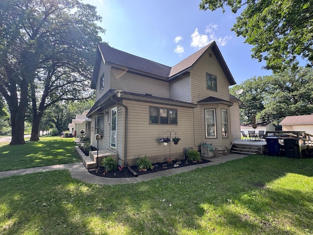 504 Laurel St, Fergus Falls, MN 56537 - view of home's exterior with a yard and a deck